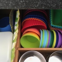 Several shapes of colorful silicone muffin cups stored in lunch packing drawer