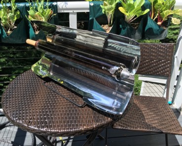 GoSun Sport solar oven in cooking mode on patio table