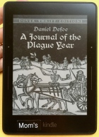 Kindle Voyage device displaying book cover Journal of the Plague Year by Defoe