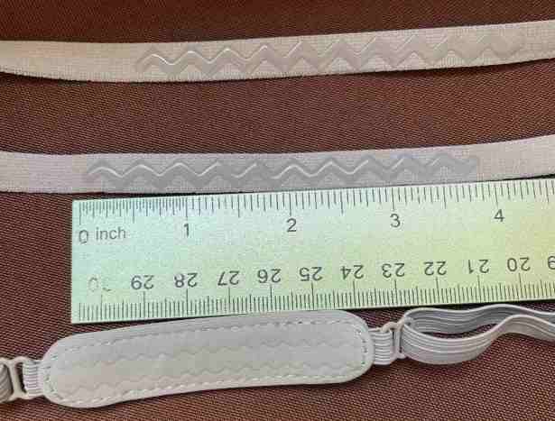 Ruler between Halo strap with 4 in grip and standard top strap with 2.5 inches of grip